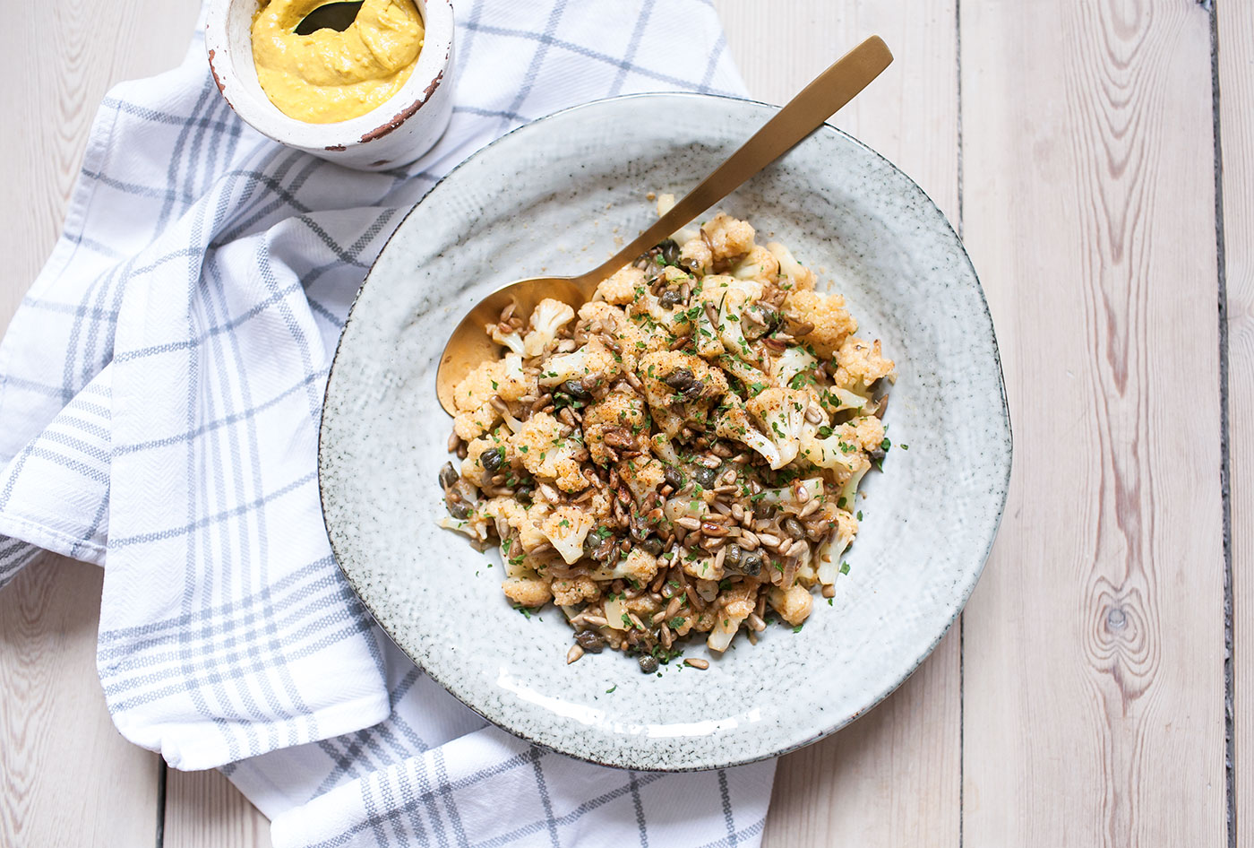 Pan-Roasted Cauliflower, Capers, Sunflower Seeds & Gruyère - Emmi USA