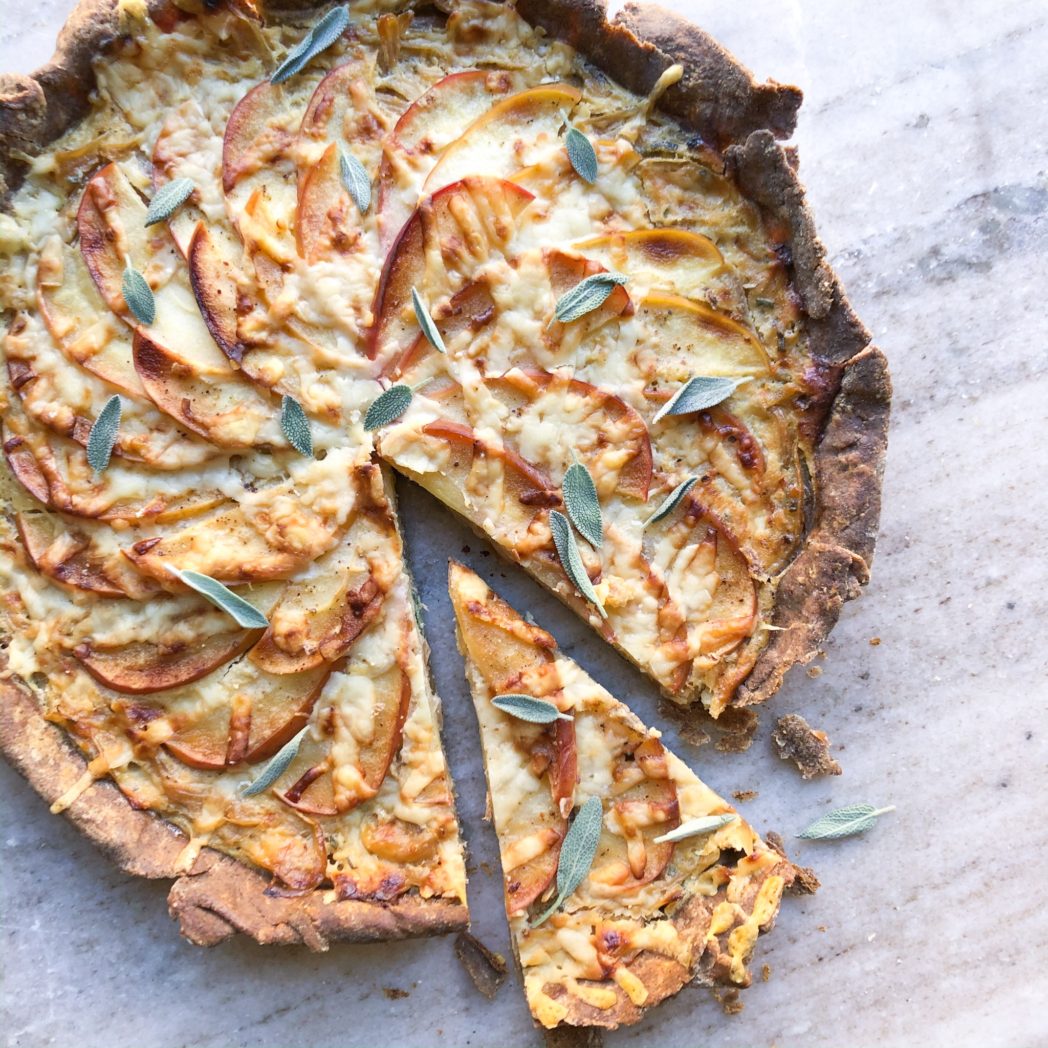 Emmi Gruyère and Caramelized Onion Tart with Apples and Sage in a Buckwheat Crust - Emmi USA